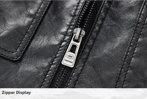 Close-up of premium metal zipper and textured leather stitching on a men's jacket