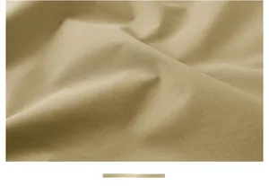 Detail of khaki twill fabric showing soft texture and smooth matte finish of the vest