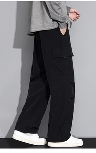 Detail view of cargo side pocket on men's relaxed fit straight-leg black work trousers