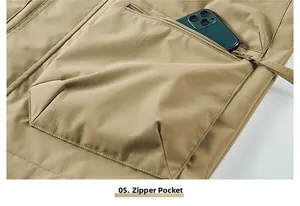 Detail of khaki cargo vest featuring a large functional zippered pocket with a phone