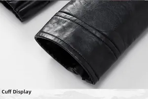 Close-up of black leather jacket cuff showing detailed lychee texture and fine stitching