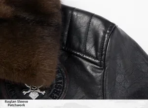 Detail of faux leather biker jacket with raglan stitching and brown fur collar