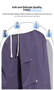 Détail d'un pantalon cargo violet avec cordon de serrage blanc et surpiqûres orange