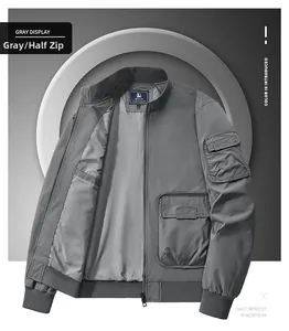 Detail of grey bomber jacket showing functional zipper sleeve pocket and utility design
