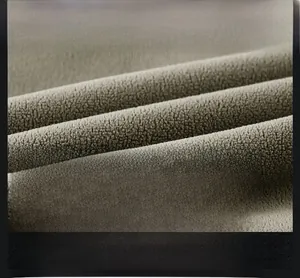 Macro close-up showing the dense texture of warm double-sided fleece fabric