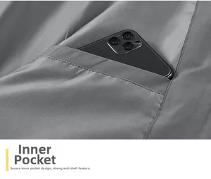 Detail of inner safety pocket on dark grey jacket showing storage for large smartphone