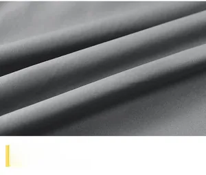 Macro detail of dark grey jacket inner lining with soft skin-friendly twill fabric texture