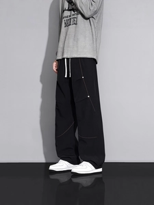 Pantalon parachute cargo homme noir ample avec surpiqûres orange et cordon de serrage blanc