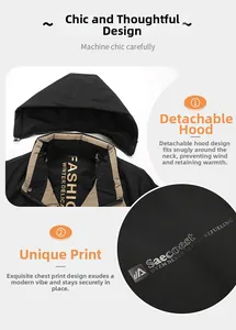 Detail of detachable hood with beige lining and chest graphic print on black winter jacket