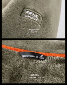 Detail of sleeve embroidery and inner collar label on green fleece jacket