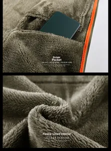 Detail of warm polar fleece lining with internal pocket and bright orange zipper accent