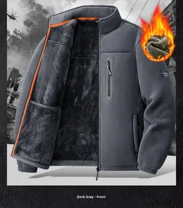 Detail of dark grey fleece jacket featuring orange piping and vertical chest pocket