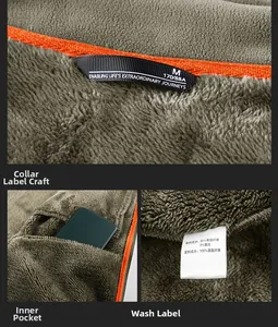 Detail of gray polar fleece jacket featuring orange lining trim and inner pocket