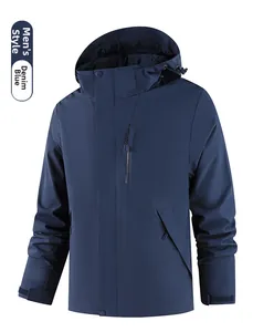 Detail view of denim blue men's waterproof windbreaker with adjustable hood and pockets