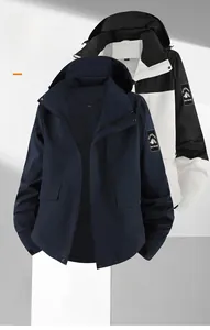 Detail view of waterproof outdoor hooded jacket showing tech fabric and 3D cutting