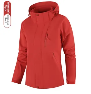 Detail of red outdoor waterproof jacket featuring zipper pockets and adjustable cuffs
