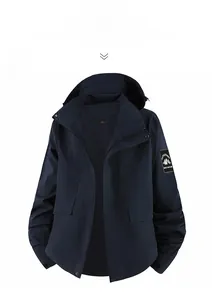Detail of navy blue outdoor jacket featuring windproof fabric and breathable mesh lining