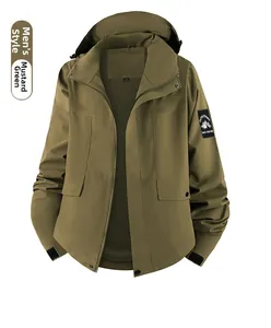 Detail of mustard green jacket showing mountain patch, mesh lining and velcro cuffs