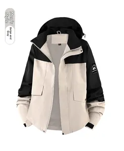 Detail of waterproof outdoor jacket for men with windproof hood and mountain sleeve patch