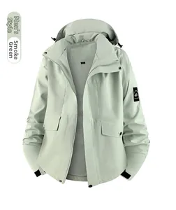 Detail of smoky cyan outdoor jacket showing hood, utility pockets and mesh lining