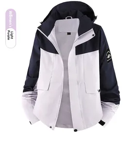 Detail of waterproof outdoor jacket for women with mountain patch and hooded design