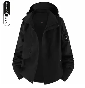 Detail of female outdoor black jacket showing sleeve patch and adjustable velcro cuff