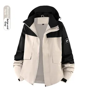 Detail of women's windproof jacket with mountain arm badge and breathable mesh lining