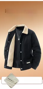Detail of premium black corduroy texture and warm sherpa fleece lining on men's jacket