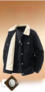 Detail of black corduroy jacket with warm white fleece lining and buttoned pocket