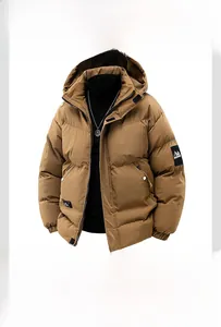 Detail of caramel puffer jacket featuring wide horizontal quilting and drawstring hood