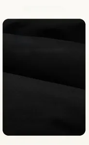 Close-up of high-density windproof black fabric texture for winter padded puffer coat