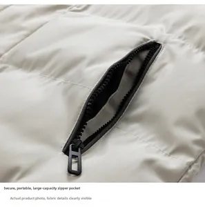 Detailed close-up of large-capacity zipper pocket on grey quilted puffer jacket