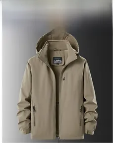 Detail of khaki outdoor jacket showing fleece lining and waterproof tactical pockets