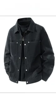 Detailed close-up of men's black workwear jacket with tiger stripe texture and contrast stitching