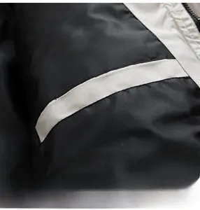 Detail shot of a men's winter hooded jacket showing a safe interior pocket for convenience