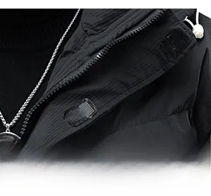 Close-up of winter jacket placket with zipper, velcro design and adjustable drawstrings