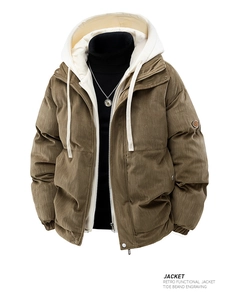 Detail of retro brown corduroy jacket with white hood and sleeve badge design