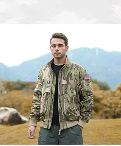 Detail of multicam tactical bomber jacket featuring a USA flag patch on the sleeve