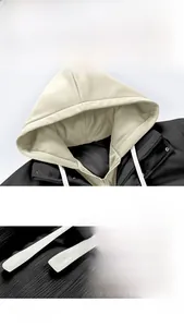 Detail of vintage functional jacket showing black corduroy texture and contrast hood drawstring