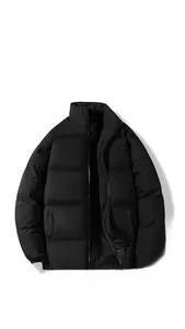 Close-up of matte black padded puffer jacket showing elastic cuffs and zipper detail