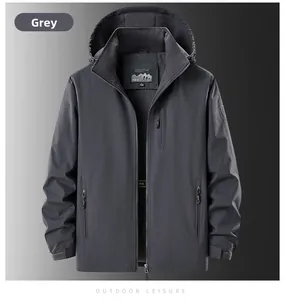 Detail view of men's grey outdoor jacket showing zipper pockets and adjustable velcro cuffs