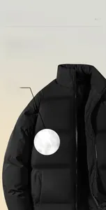 Detailed view of the quilted stand-up collar and high-quality zipper of the black puffer jacket