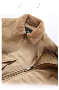 Detail of khaki work jacket featuring thick sherpa fleece collar and vintage metal zipper