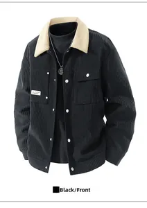 Detail of black corduroy jacket with beige faux fur collar and white buttons