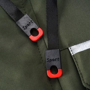 Detail of drawstring on army green outdoor jacket with Sport logo and reflective strip