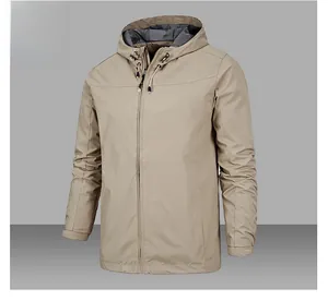 Detail view of khaki hooded outdoor jacket with adjustable drawstrings and cuffs