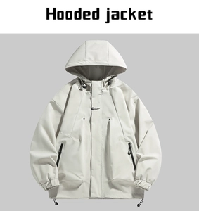 Detail of hooded jacket with adjustable drawstring and front fashion sports lettering