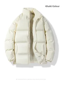 Detailed close-up of quilted off-white winter jacket with zipper and elastic cuffs