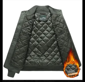 Detail of army green bomber jacket featuring diamond quilted lining and ribbed cuffs