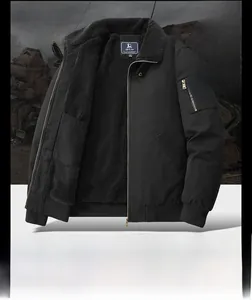 Close-up of black winter cargo jacket with MA-1 zipper pocket and warm faux fur collar